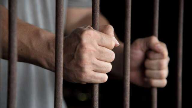 Hands Of The Prisoner In Jail